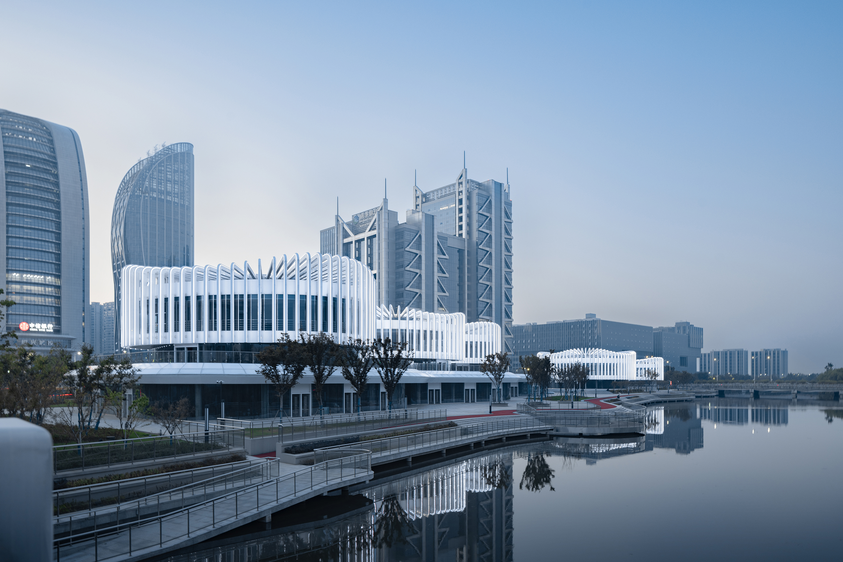 water-inspired architecture, riverfront buildings, urban design, modern Chinese architecture, tranquil environments, architectural aesthetics, public spaces, innovative structures, landscape and architecture, iconic projects